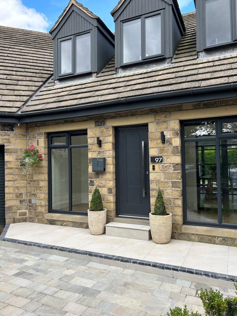 a house with two large planters in front of it